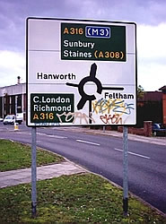 Grafitti'd road sign