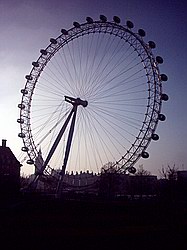 London Eye, silhouetted against the mid-afternoon glare