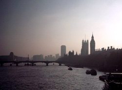 Big Ben and the House of Commons disappear in the sun's haze