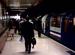 Commuters leaving the Waterloo and City line platform at Waterloo