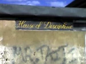 Painted sign that reads 'House of Discipline'