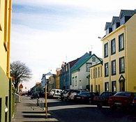 Narrow streets of brightly-coloured corrugated iron houses