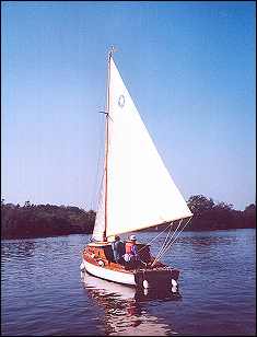 Leaving the island mooring on Malthouse Broad after coming in under sail. I'm taking the photograph, tutor Anton is on board with Lisa.